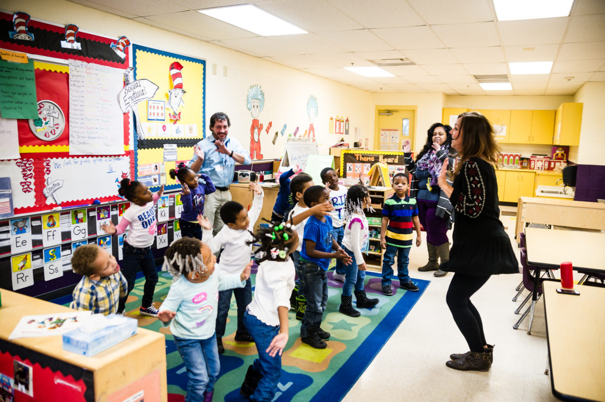 Teaching artist dancing with children