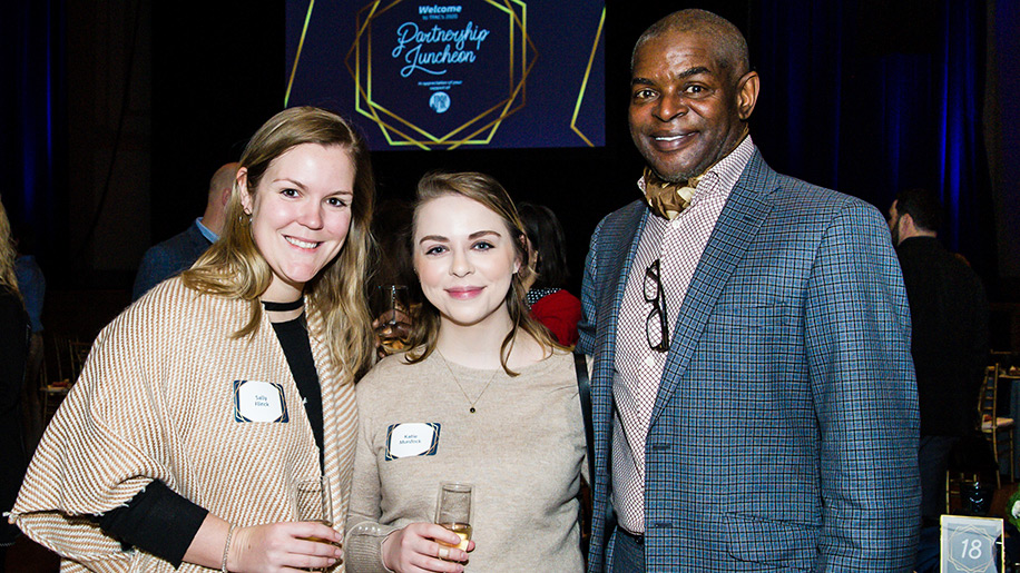 two women and a man posing at TPAC's Partnership Luncheon